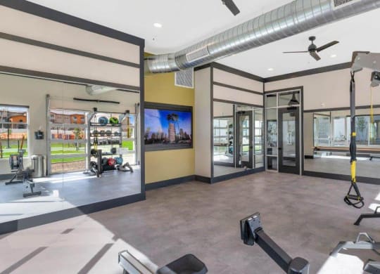 Fitness center with equipment at Glen 91 Apartments in Glendale, AZ