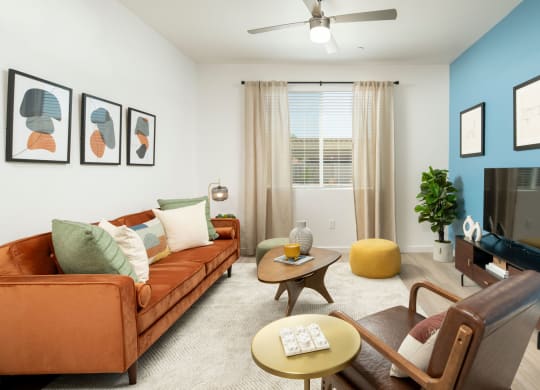 a living room with white walls and a blue accent wall