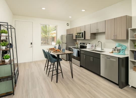 a kitchen and dining area in a 555 waverly unit