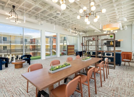 a large room with a long wooden table and chairs