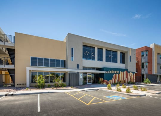 a large building with a parking lot in front of it