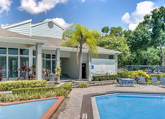 Community pool with the clubhouse in the background