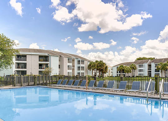 View of the pool, with the apartments in the background