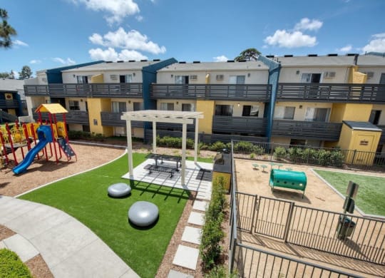 Playground, picnic area, and dog park at Horizon Apartments in Santa Ana, California