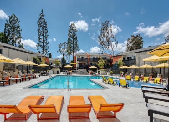Pool deck with loungers at Horizon Apartments in Santa Ana, California