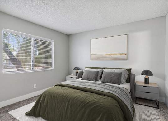 an empty bedroom with a bed and a window