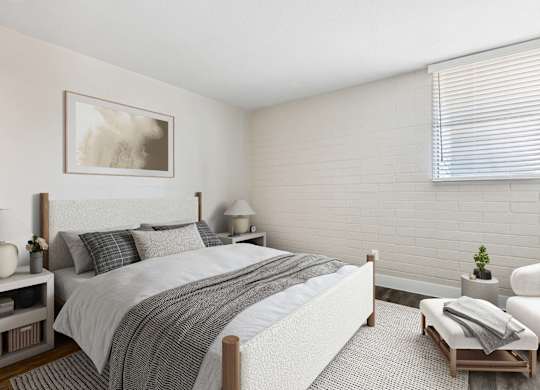One-Bedroom Apartments in Camelback East Village, AZ - Arcadia on 49th - A Bright Bedroom With A White Upholstered Bed, Neutral Bedding, Side Tables With Lamps, And A Large Window.