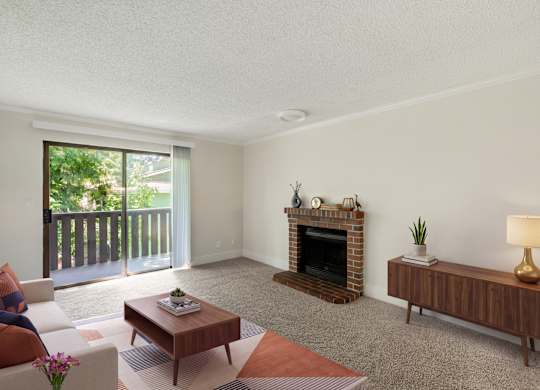 A living room with a fireplace and a couch.