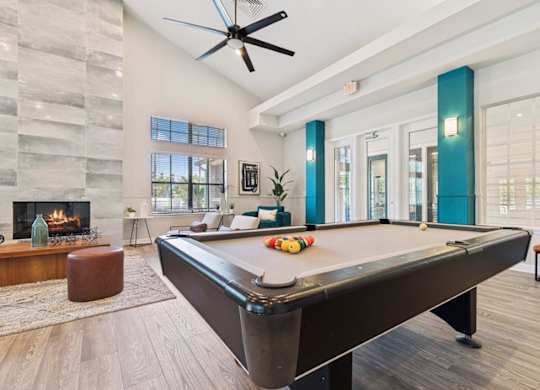 Resident lounge with billiards table at Mirage on Kernan Apartments in Jacksonville, FL