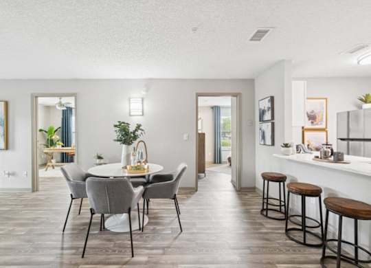 Model kitchen and dining at Mirage on Kernan Apartments in Jacksonville, FL