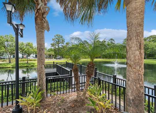 Community lake and landscaping at Mirage on Kernan Apartments in Jacksonville, FL