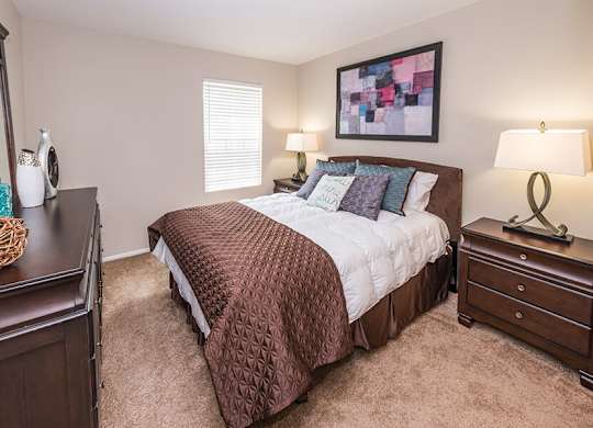 Model Bedroom with Carpet at Misty Ridge Apartments located in Woodbridge, VA.