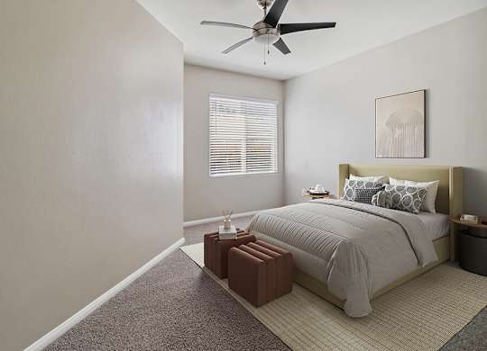 A bedroom with a bed, nightstand, and window with blinds.