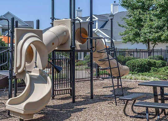 A playground with a slide shaped like a human ear.