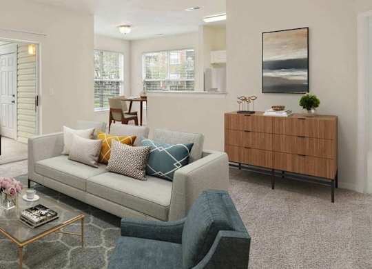 A living room with a couch, coffee table, and sliding glass doors.