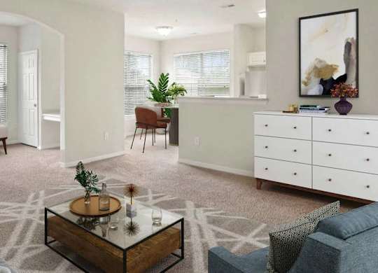 A living room with a grey couch, a coffee table, and a white dresser.
