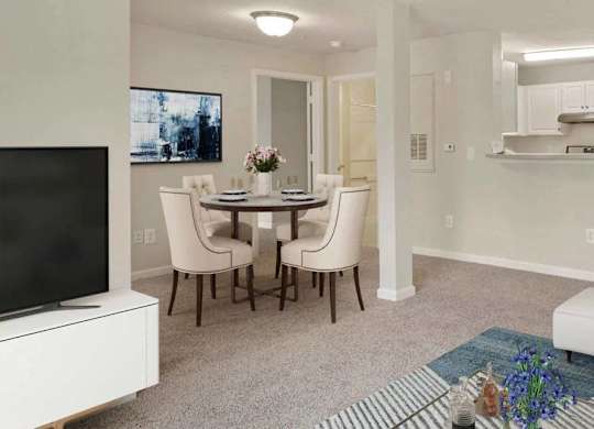 A living room with a white couch and a television.
