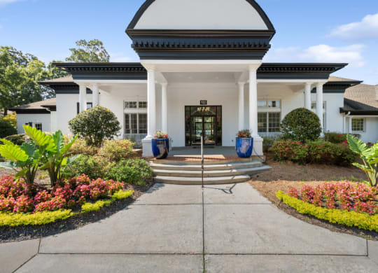 a large white building with a black door