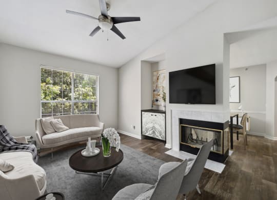 a living room with a fireplace and a tv above it
