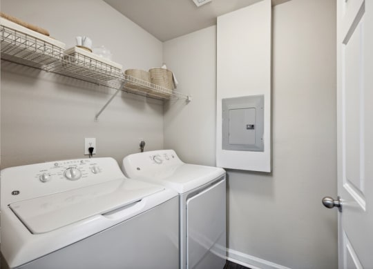 a white washer and dryer in a room
