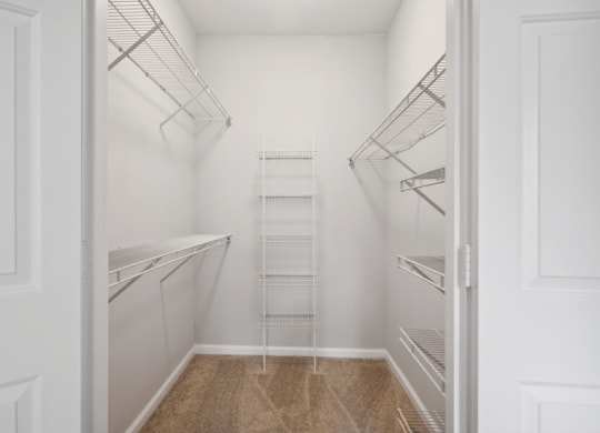 a walk in closet in a 555 waverly unit