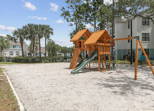 Community Playground with Slide and Swing Set at Mirage on Kernan Apartments located in Jacksonville, FL.