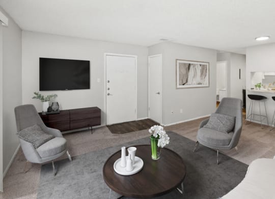 Model apartments living room with a tv and a table