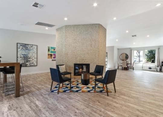 Clubhouse entrance with fireplace and chairs