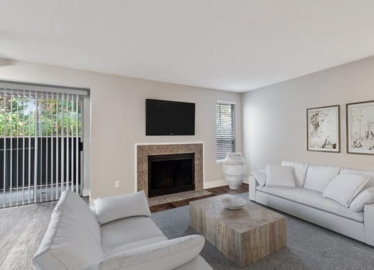 Model living room with private patio/balcony