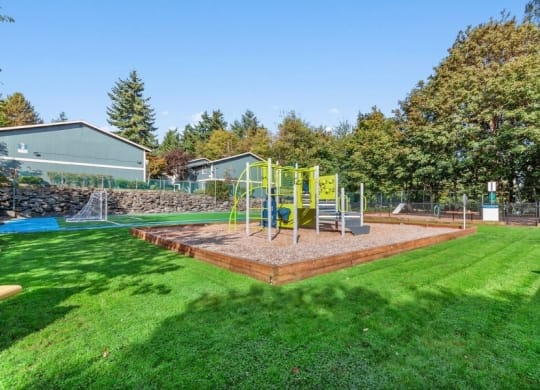 Playground park next to brand new soccer field and well kept landscape