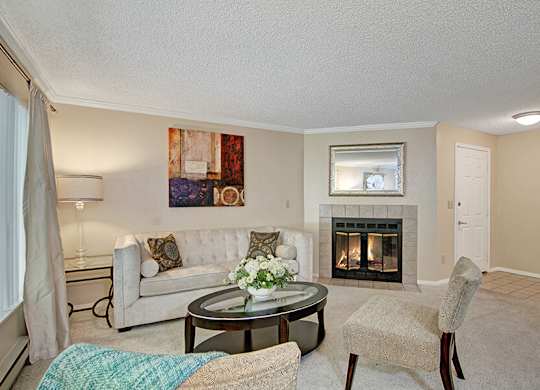 Model Living Room and Fireplace at Ridge & Shores Apartments located in Federal Way, WA.
