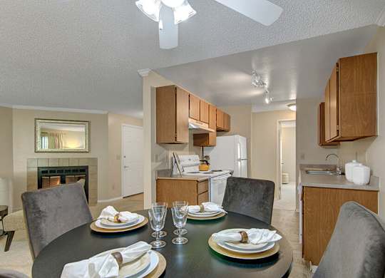 Model Dining Room and Kitchen at Ridge & Shores Apartments located in Federal Way, WA.