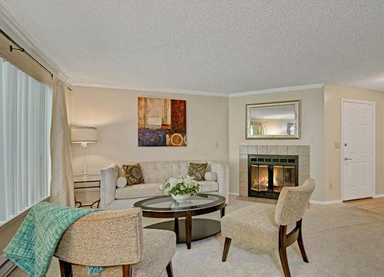 Model Living Room and Fireplace at Ridge & Shores Apartments located in Federal Way, WA.