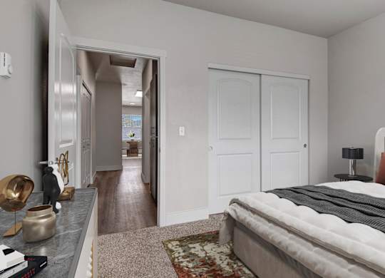 A bedroom with a large bed and a mirror on the wall.