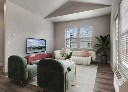 A living room with a television, two chairs, and a couch.