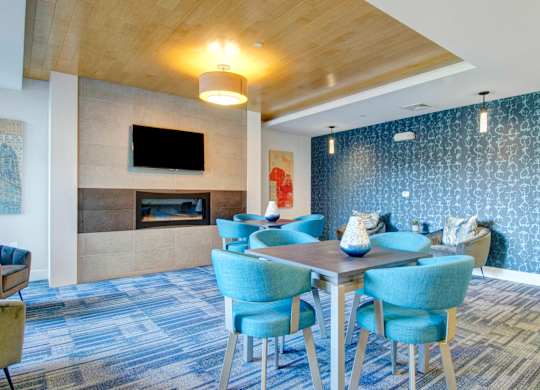 A conference room with a long table and chairs.