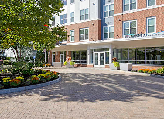 A brick building with a white awning and a sign that says