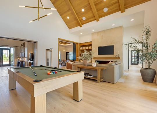 a pool table in the middle of a living room