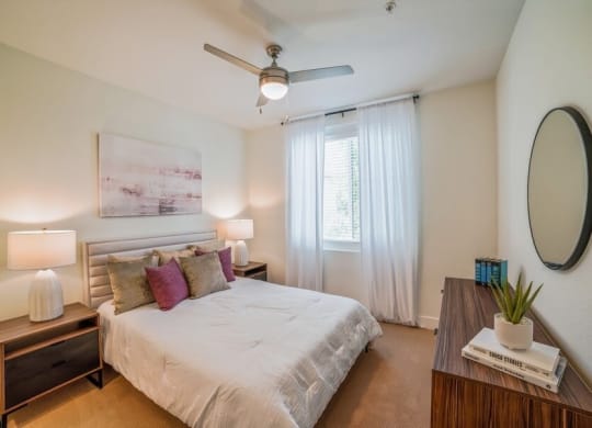 Model bedroom with carpeting and fan
