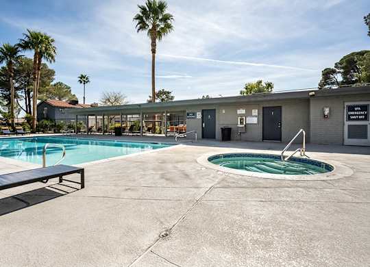 Community Swimming Pool & Hot Tub at Bridges at Tropicana Apartments located in Las Vegas, Nevada.