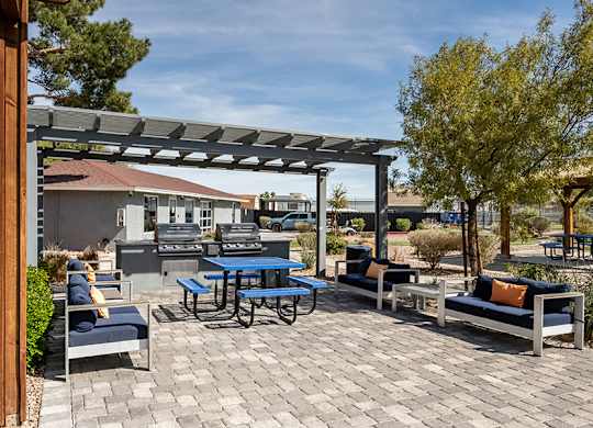 Outdoor Grilling Stations at Bridges at Tropicana Apartments located in Las Vegas, Nevada.
