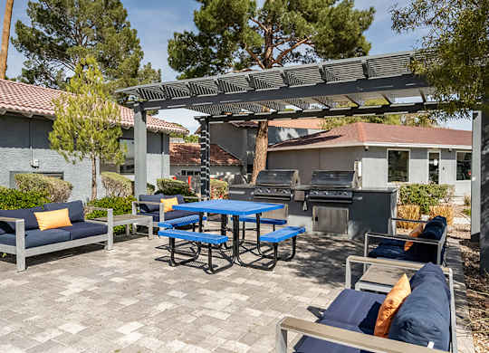 Outdoor Grilling Stations at Bridges at Tropicana Apartments located in Las Vegas, Nevada.