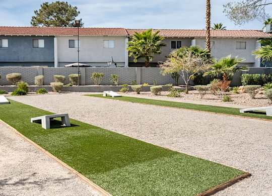 Community Corn Hole Area at Bridges at Tropicana Apartments located in Las Vegas, Nevada.