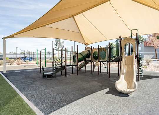 Community Playground at Bridges at Tropicana Apartments located in Las Vegas, Nevada.