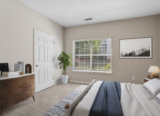Bedroom with a large bed and a window