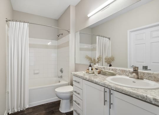 Bathroom with a shower toilet and sink