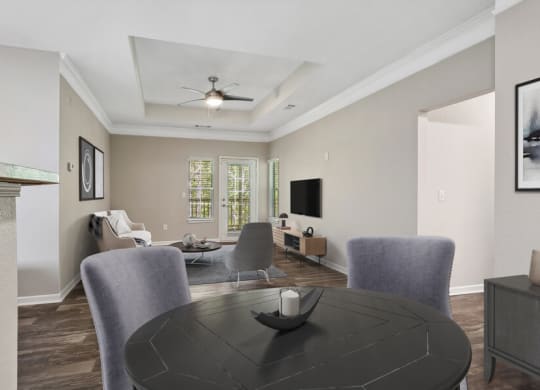 Model apartment dining room with a table and chairs
