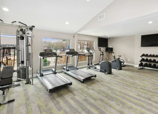 Fitness center with treadmills, stationary bikes and weights