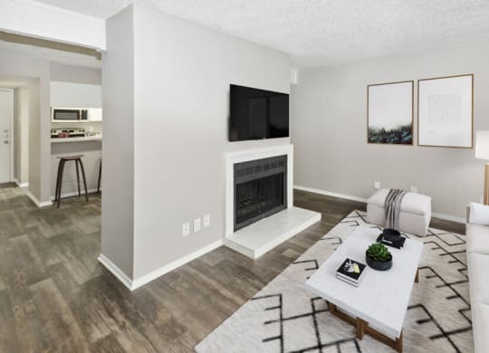 a living room with a fireplace and a table