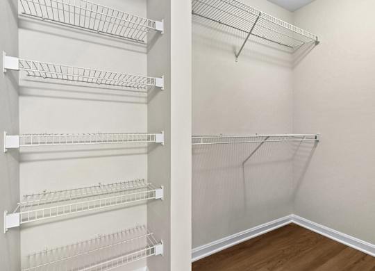 Walk-in closet with wire shelving system at The Courts at Fair Oaks Apartments, Virginia, 22030